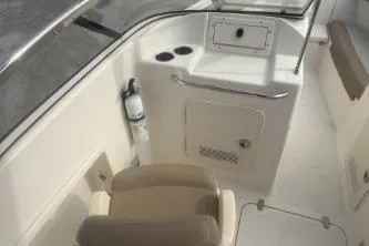 Slide: The Image of 2022 Scout 210 Dorado boat interior with seating and storage features. - 9