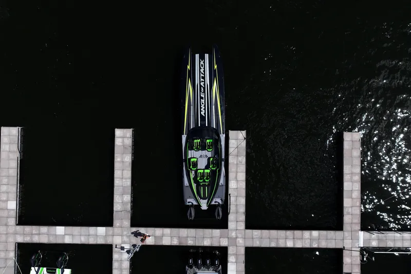 Slide: The Image of Aerial view of 2025 Mystic Powerboats C4000 docked at a marina. - 12