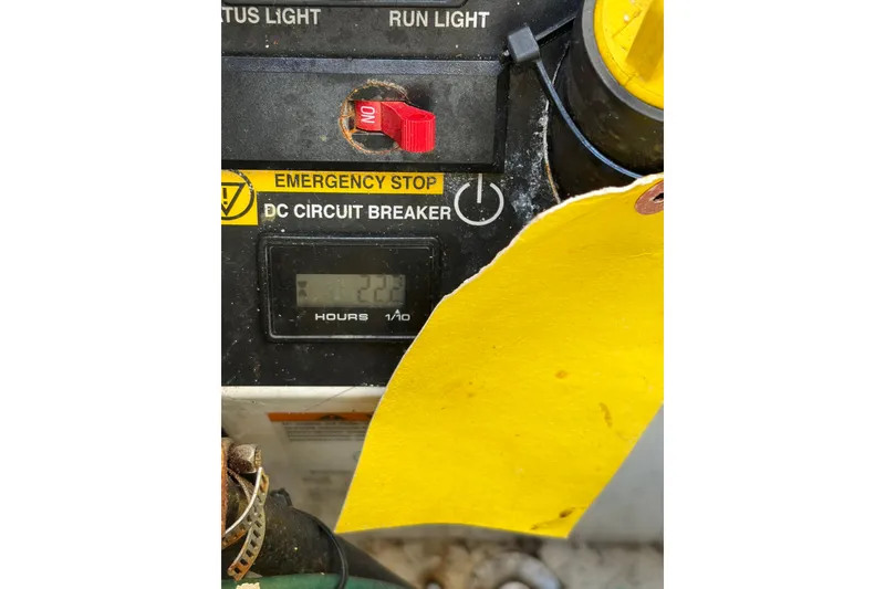 Slide: The Image of Control panel of a 2013 Tiara Yachts 3600 Coronet with emergency stop and circuit breaker. - 21