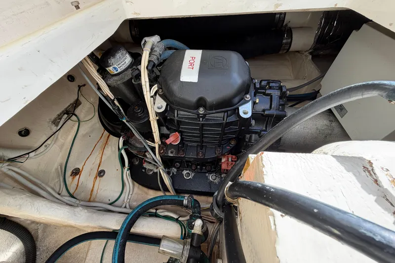 Slide: The Image of Engine compartment of 2013 Tiara Yachts 3600 Coronet, showcasing mechanical components and wiring. - 22