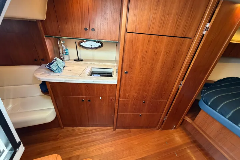 Slide: The Image of Interior of 2013 Tiara Yachts 3600 Coronet with wood cabinetry and seating area. - 5