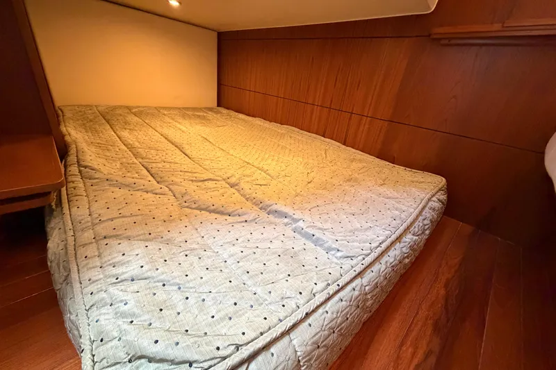 Slide: The Image of Cozy cabin bed in 2013 Tiara Yachts 3600 Coronet with wooden interior. - 6