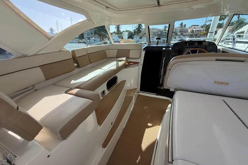 Slide: The Image of Interior of 2013 Tiara Yachts 3600 Coronet, featuring beige seating and helm station. - 7