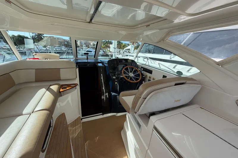 Slide: The Image of Interior of 2013 Tiara Yachts 3600 Coronet, featuring helm and seating area. - 8
