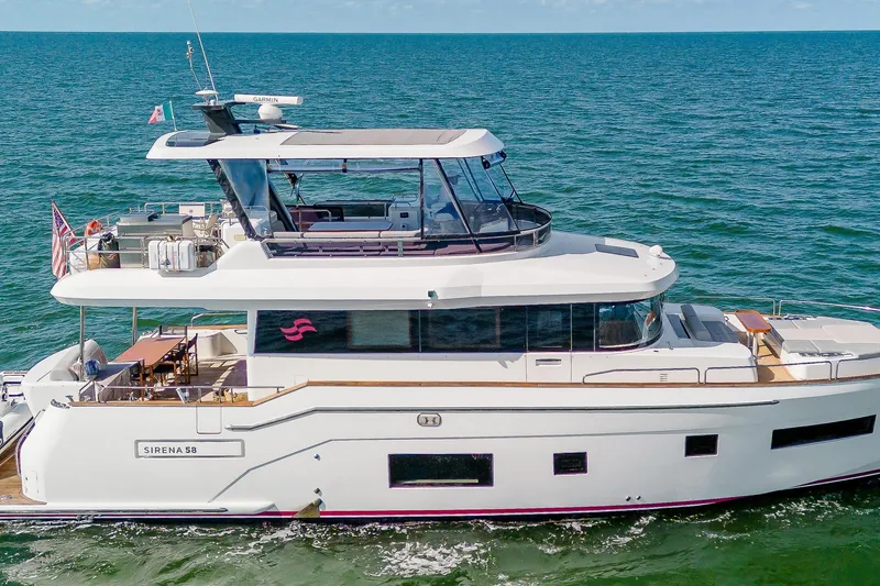 The Image of 2023 Sirena 58 yacht cruising on open sea, showcasing sleek design and luxury features. - 1