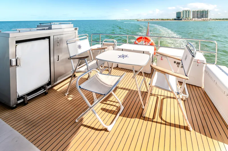 Slide: The Image of Deck of 2023 Sirena 58 yacht with seating and ocean view. - 10