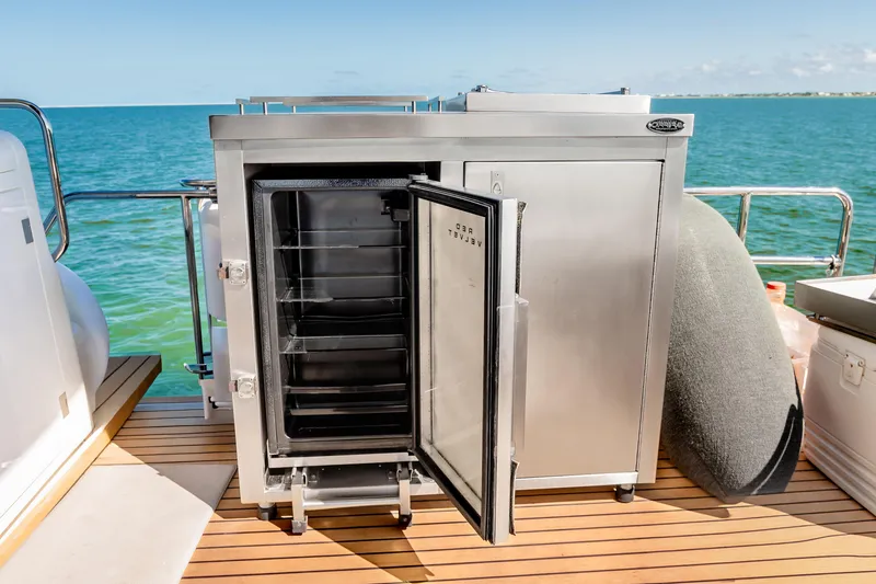 Slide: The Image of Stainless steel refrigerator on Sirena 58 yacht deck, 2023 model, with ocean view. - 12