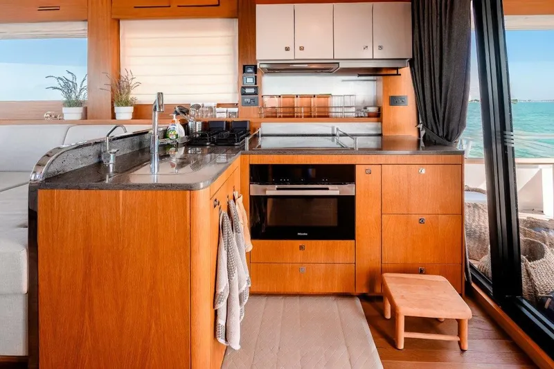 Slide: The Image of Luxurious 2023 Sirena 58 yacht kitchen with modern appliances and ocean view. - 15