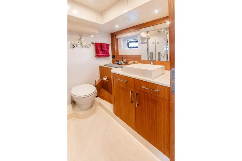 Slide: The Image of Luxurious bathroom in 2023 Sirena 58 yacht with modern fixtures and wooden cabinetry. - 25