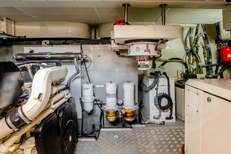 Slide: The Image of Engine room of 2023 Sirena 58 yacht, showcasing advanced mechanical systems and equipment. - 29