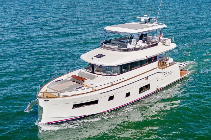 Slide: The Image of Luxurious 2023 Sirena 58 yacht cruising on open sea waters. - 3