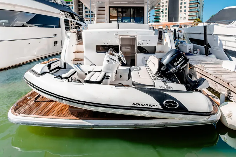 Slide: The Image of 2023 Sirena 58 yacht with Walker Bay tender and Yamaha engine at marina. - 32