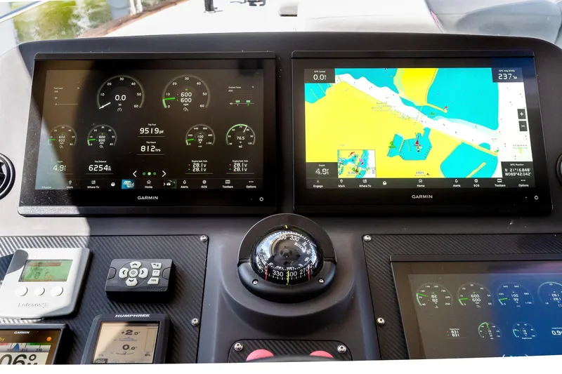 Slide: The Image of Cockpit of 2023 Sirena 58 yacht featuring advanced Garmin navigation displays. - 6