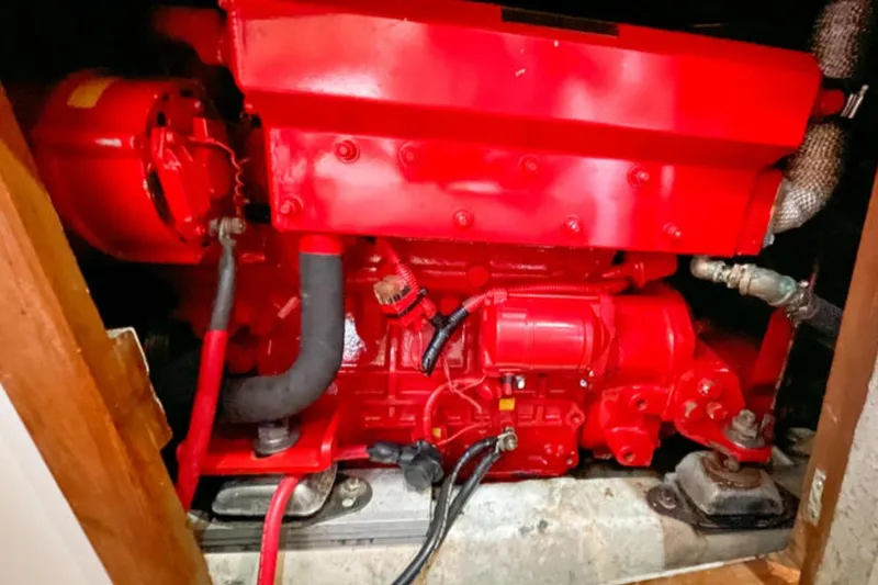 Slide: The Image of Red engine inside a 1994 Catalina Morgan 38 sailboat. - 23