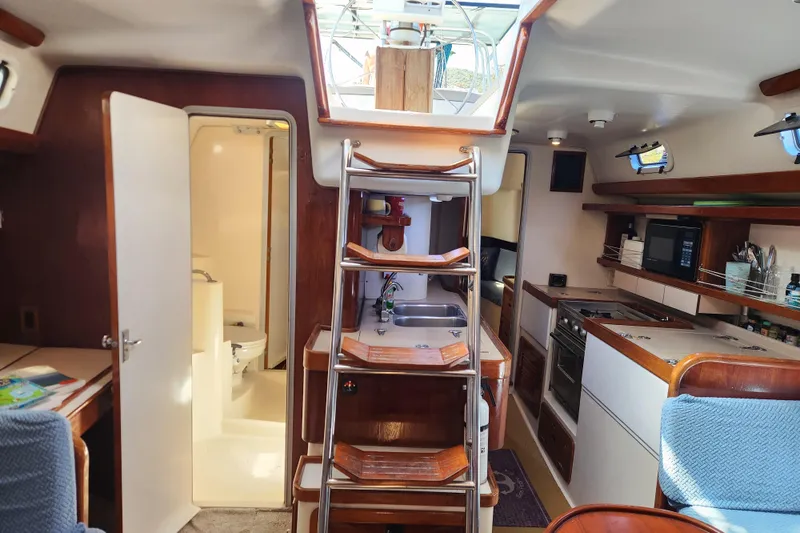 Slide: The Image of Interior of a 1994 Catalina Morgan 38 sailboat with kitchen and bathroom. - 9