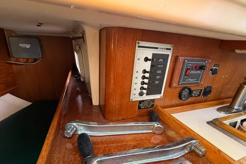 Slide: The Image of 1985 Niagara Encore boat interior with control panel and wooden finish. - 23