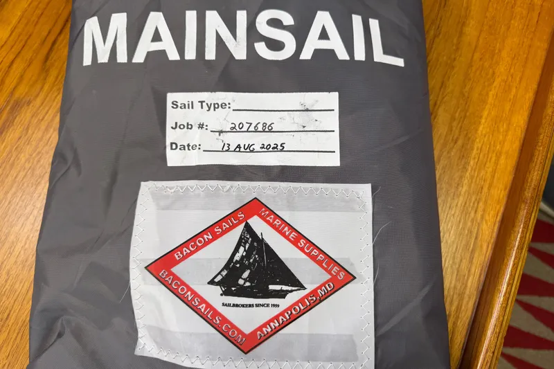 Slide: The Image of Gray mainsail bag with Bacon Sails logo, job number 207686, dated August 13, 2025. - 30