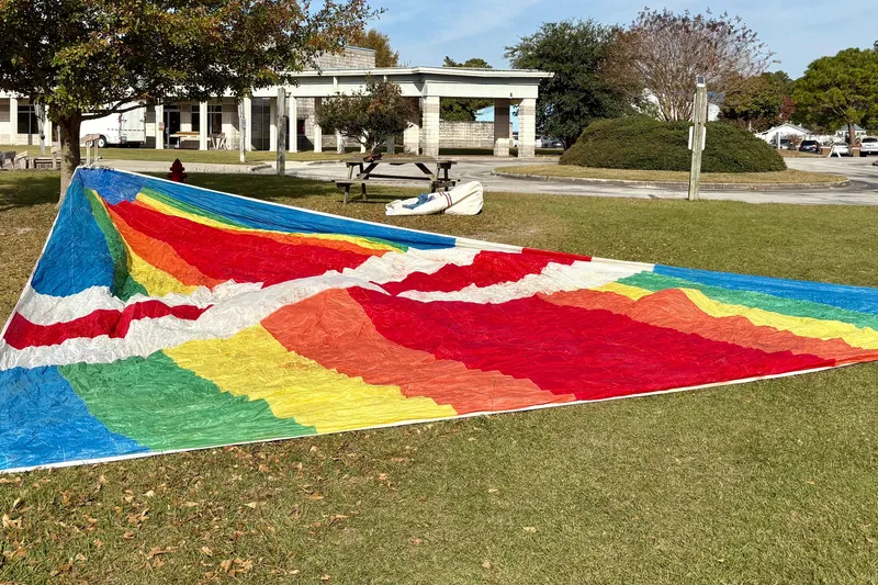 Slide: The Image of Colorful hang glider on grass, Niagara model from 1985, with vibrant rainbow design. - 31