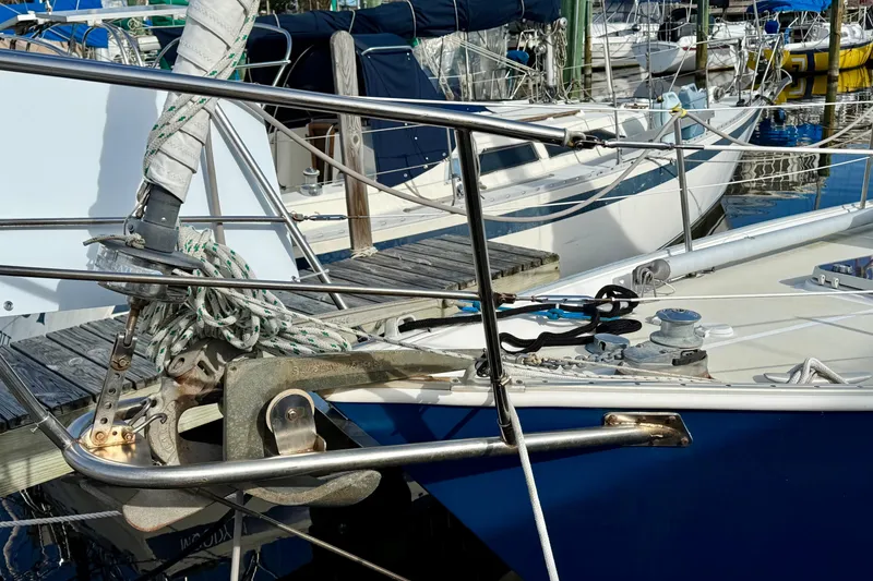 Slide: The Image of 1985 Niagara Encore sailboat bow with anchor and ropes at marina. - 4