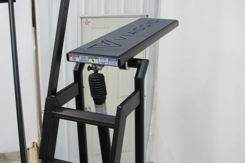 Slide: The Image of Viaggio Lago X22U 2026 model ladder with safety features and weight limit warning. - 4