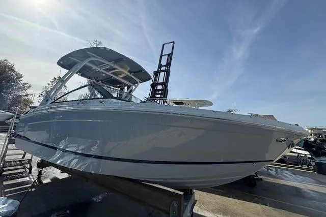 Slide: The Image of 2026 Cobalt R6 boat on trailer under clear sky. - 13