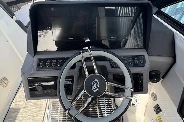 Slide: The Image of 2026 Cobalt R6 boat dashboard with dual screens and modern steering wheel. - 19