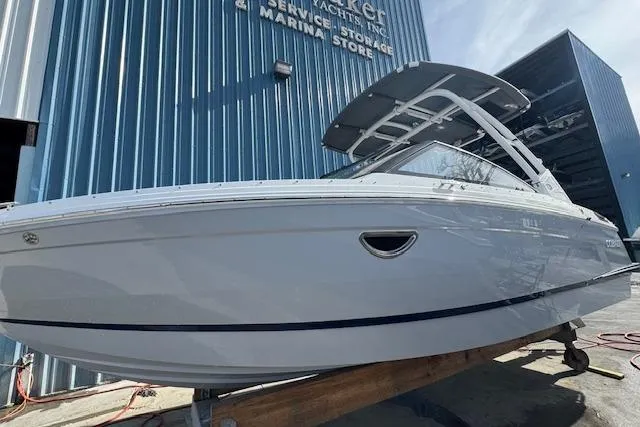Slide: The Image of 2026 Cobalt R6 boat displayed outside a marine storage facility. - 4