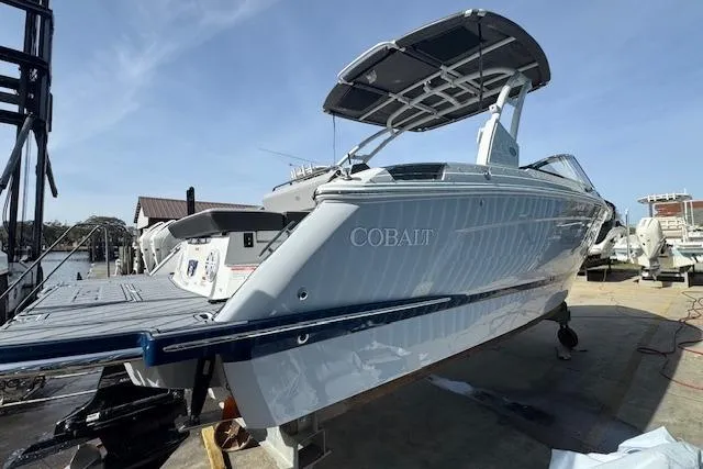 Slide: The Image of 2026 Cobalt R6 boat docked, showcasing sleek design and modern features. - 9