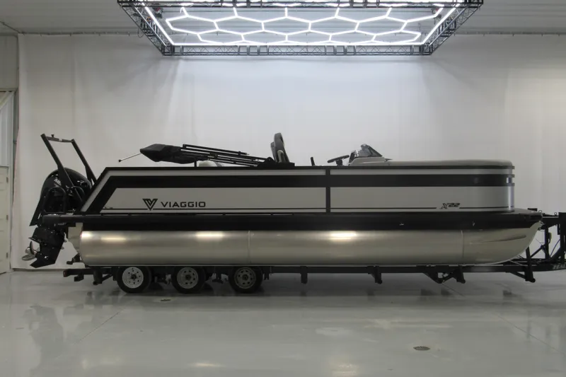 The Image of 2026 Viaggio Lago X22S pontoon boat in a showroom, side view. - 0