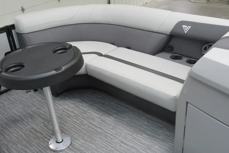 Slide: The Image of 2026 Viaggio Lago X22S boat interior with gray seating and round table. - 5