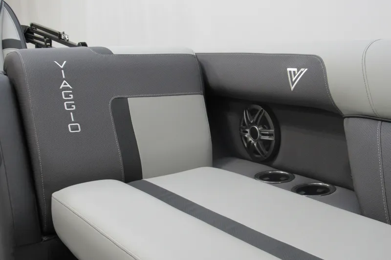 Slide: The Image of 2026 Viaggio Lago X22S boat interior with sleek gray seating and integrated speaker system. - 8