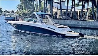 The Image of 2014 Sea Ray SLX 300 boat on water with palm trees. - 0