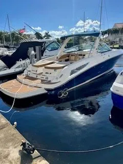 Slide: The Image of 2014 Sea Ray SLX 300 boat docked in sunny marina. - 3