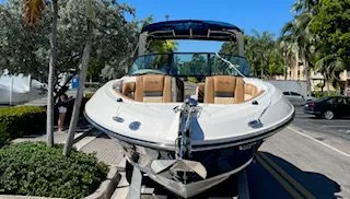 Slide: The Image of 2014 Sea Ray SLX 300 boat on trailer, sunny day. - 4