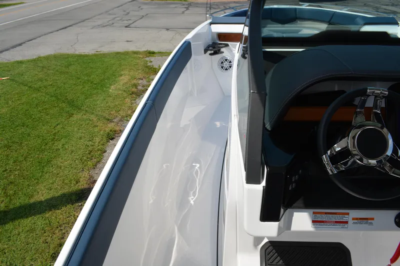 Slide: The Image of 2026 Monterey Elite 27 OB boat interior with sleek design and modern steering wheel. - 11