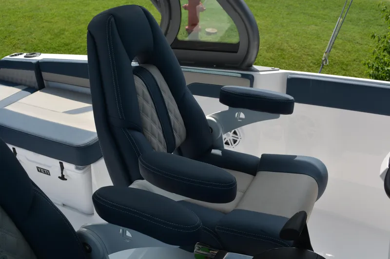 Slide: The Image of Luxury seating on 2026 Monterey Elite 27 OB boat, featuring plush upholstery and armrests. - 12