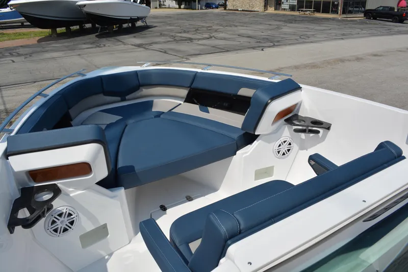 Slide: The Image of 2026 Monterey Elite 27 OB boat interior with blue seating and cup holders. - 15