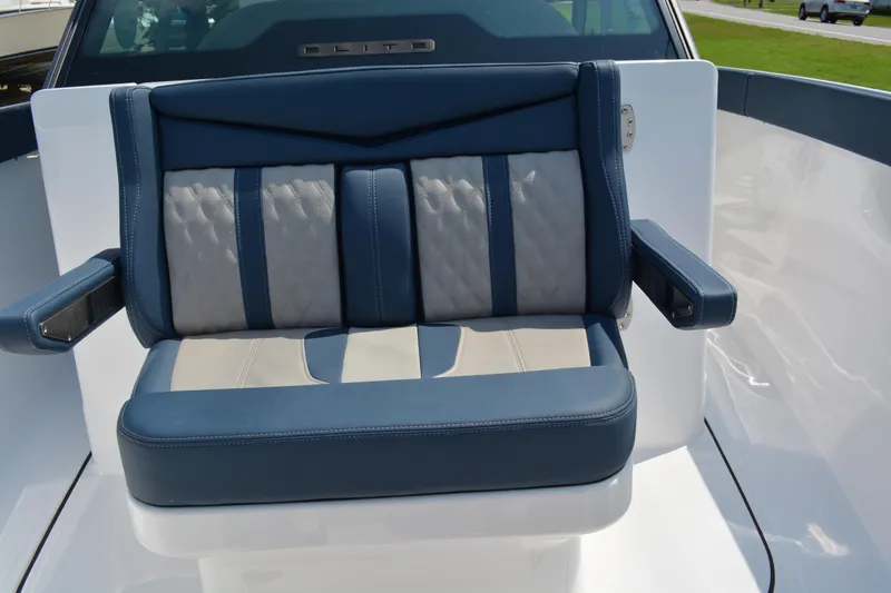 Slide: The Image of 2026 Monterey Elite 27 OB boat seat with blue and gray upholstery, featuring armrests. - 16