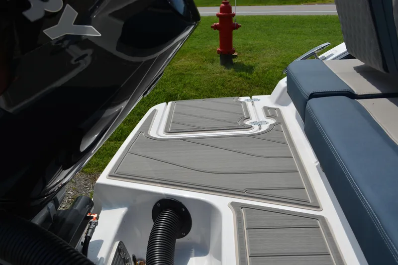 Slide: The Image of 2026 Monterey Elite 27 OB boat deck with cushioned seating and sleek design. - 9