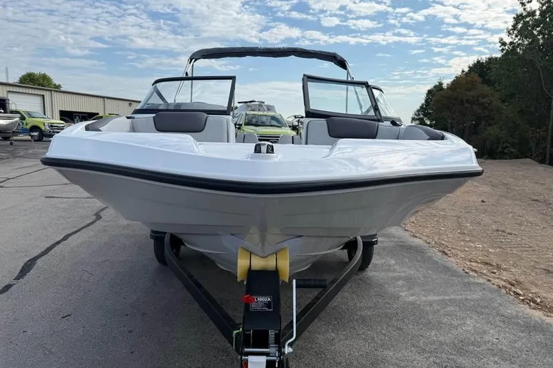 Slide: The Image of 2026 Yamaha Boats SX190 on trailer, parked outdoors under a partly cloudy sky. - 2