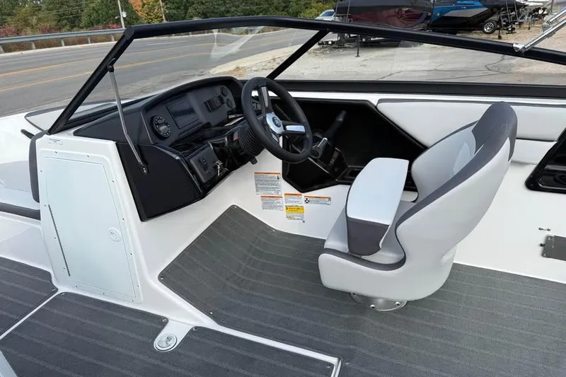 Slide: The Image of 2026 Yamaha Boats SX190 cockpit with steering wheel and captain's chair, featuring modern design. - 7