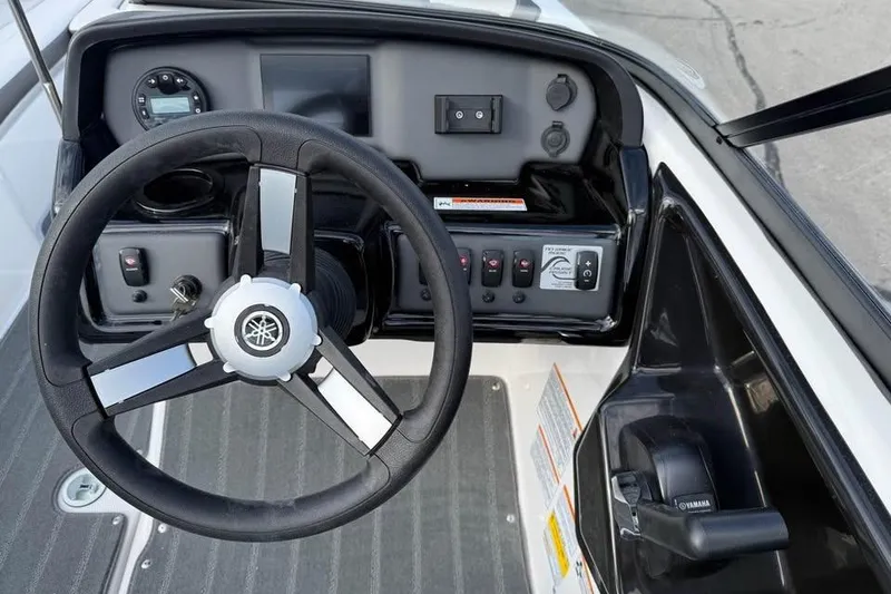 Slide: The Image of 2026 Yamaha Boats SX190 dashboard with steering wheel and control panel. - 8