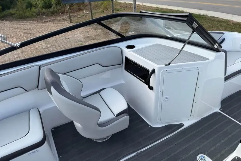Slide: The Image of 2026 Yamaha Boats SX190 interior with sleek seating and modern dashboard design. - 9