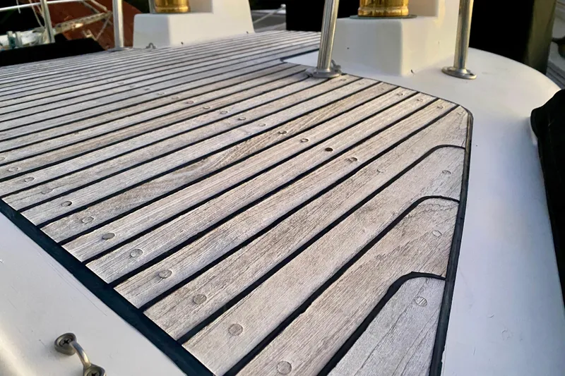 Slide: The Image of Teak deck of 1991 Hans Christian 41 T Molakai sailboat, showcasing detailed woodwork. - 102