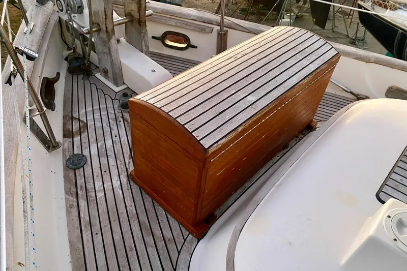 Slide: The Image of 1991 Hans Christian 41 T Molakai sailboat deck with wooden storage chest. - 107