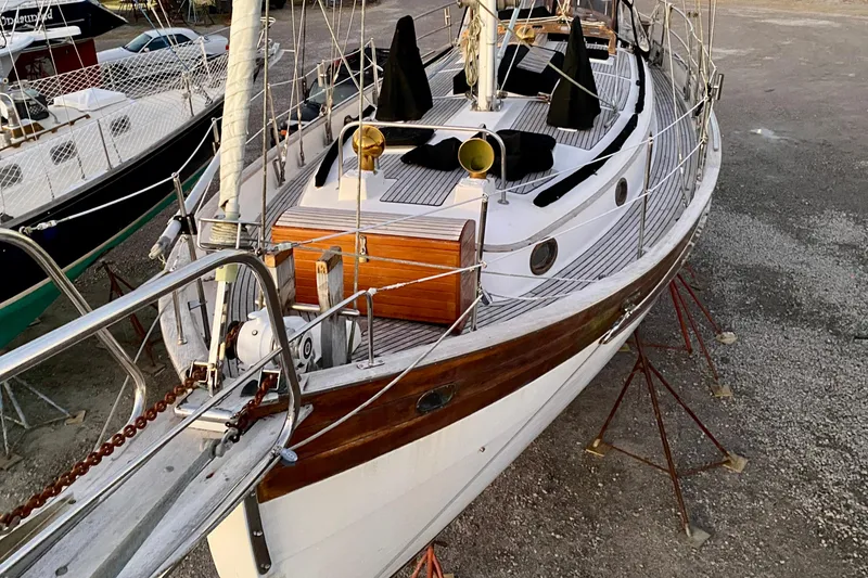 Slide: The Image of 1991 Hans Christian 41 T Molakai sailboat on stands, showcasing deck and rigging. - 110