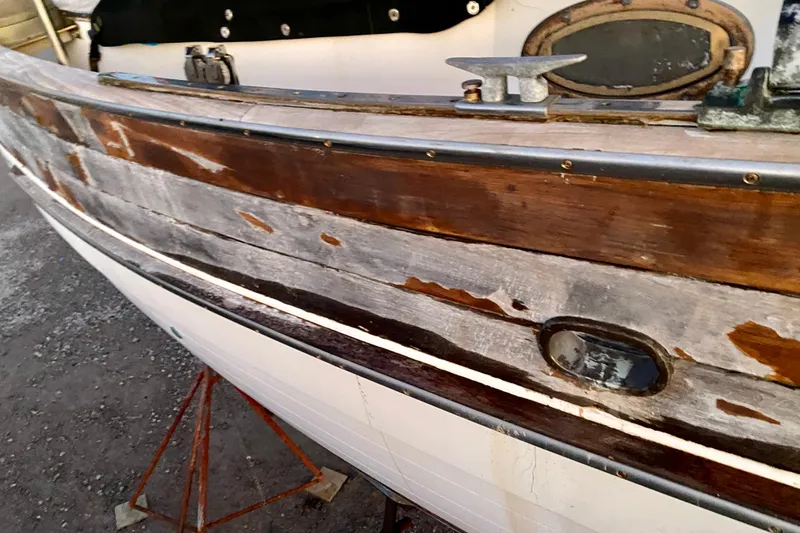 Slide: The Image of 1991 Hans Christian 41 T Molakai sailboat with weathered wooden hull detail. - 119