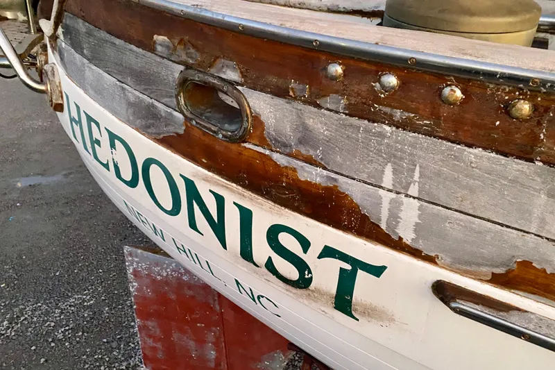 Slide: The Image of 1991 Hans Christian 41 T Molakai sailboat named "Hedonist" with weathered wood finish. - 120