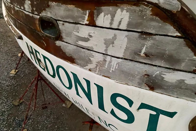 Slide: The Image of Weathered 1991 Hans Christian 41 T Molakai sailboat with "Hedonist" name, on stands. - 122