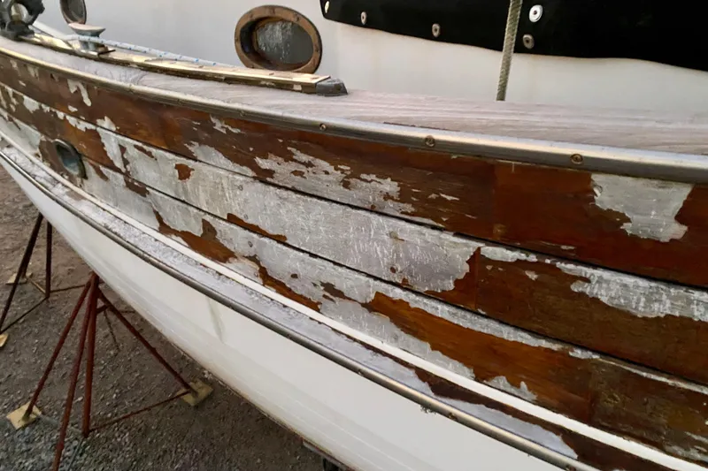 Slide: The Image of Weathered wooden hull of 1991 Hans Christian 41 T Molakai sailboat. - 123